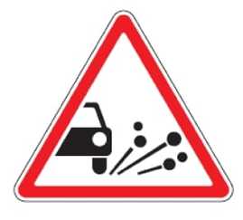 121 Žvyras (patobulintos dangos kelio ruožas, kuriame iš po ratų gali būti išsviesta žvyro, skaldos ir panašiai)